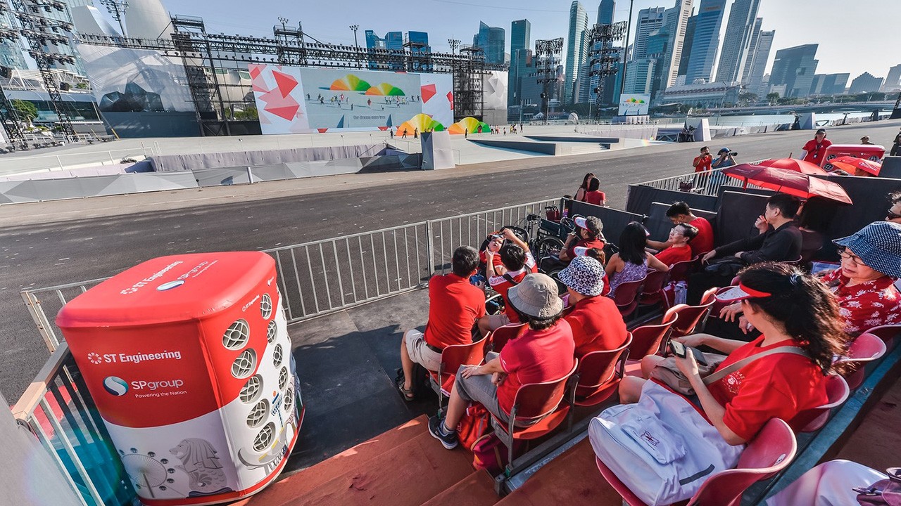 Spectators on the floating platform at Marina Bay are cooled by 'recycled' cold air from a district cooling system. Image: SP Group